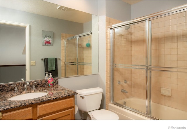 9864 Carmel Ct, Lone Tree, CO 80124 - bathroom featuring vanity and bath / shower combo with glass door