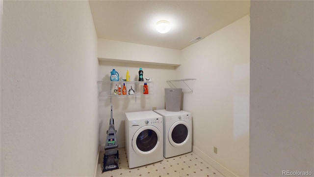 9864 Carmel Ct, Lone Tree, CO 80124 - laundry room featuring washer and clothes dryer and light floors