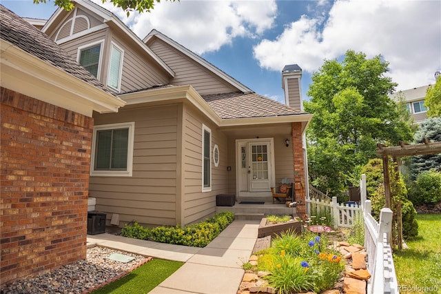 9864 Carmel Ct, Lone Tree, CO 80124 - entrance to property with a chimney