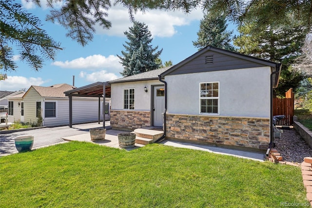 ranch-style house featuring a patio and a front yard