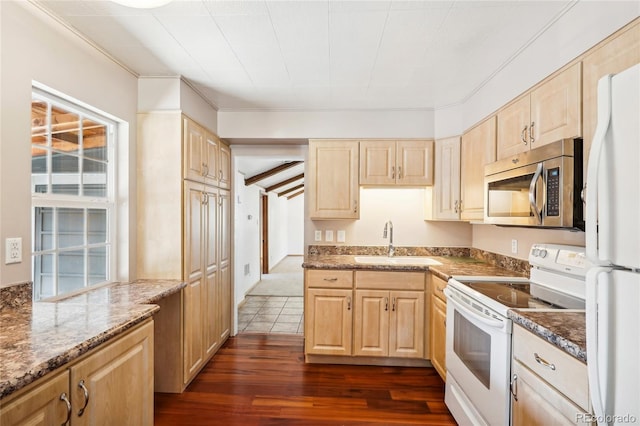 kitchen featuring light brown cabinets, white appliances, dark hardwood / wood-style flooring, and sink