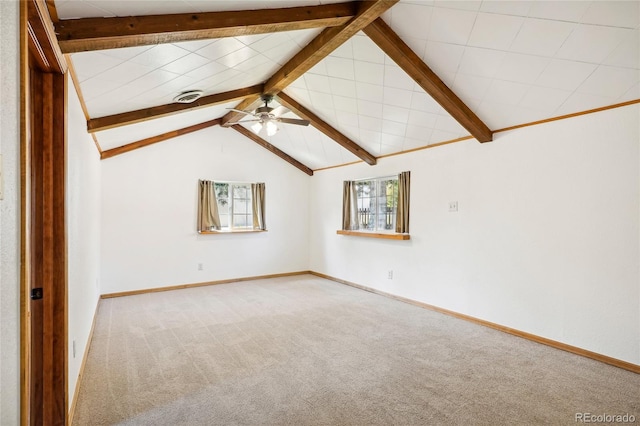 unfurnished room featuring vaulted ceiling with beams, carpet, and ceiling fan