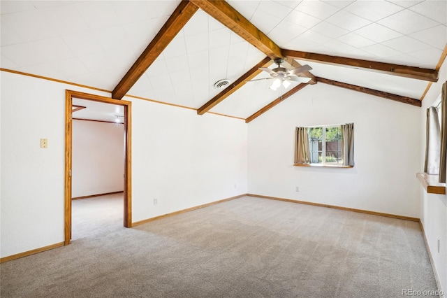 interior space featuring lofted ceiling with beams, ceiling fan, and light colored carpet