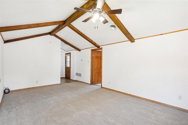 spare room with lofted ceiling with beams, ceiling fan, and light colored carpet