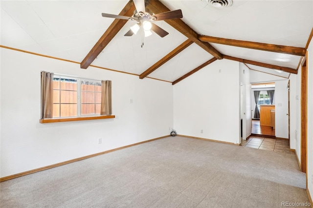 interior space featuring ceiling fan, lofted ceiling with beams, and light carpet