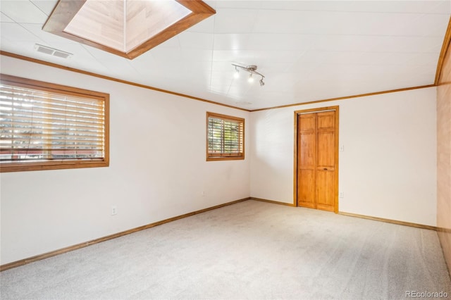 unfurnished bedroom featuring carpet and crown molding