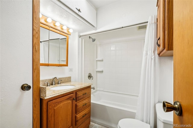 full bathroom with vanity, toilet, and shower / bath combo with shower curtain