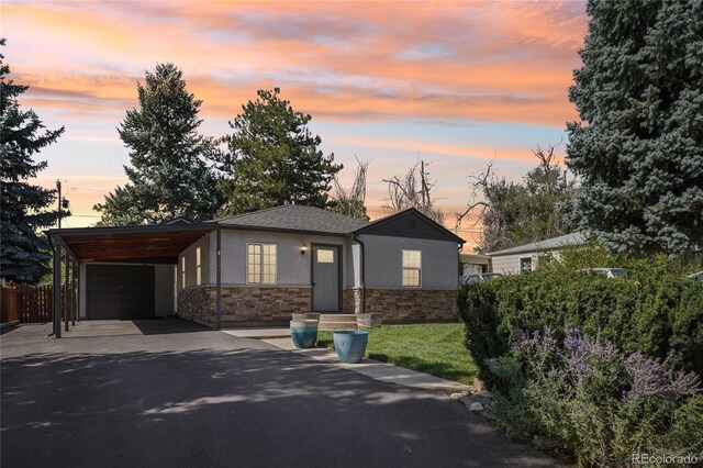 view of front of home featuring a yard and a carport