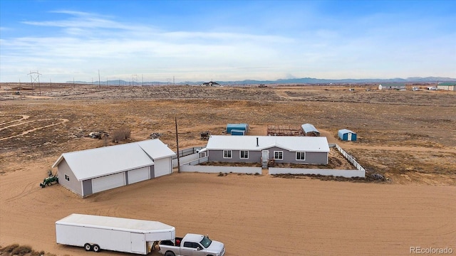 drone / aerial view with a mountain view and a rural view