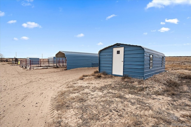 view of outbuilding featuring a rural view