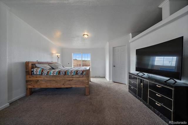 bedroom featuring carpet flooring and a textured ceiling