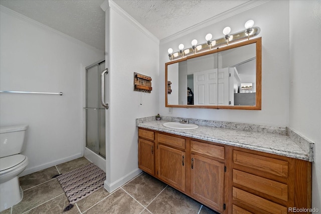 bathroom featuring vanity, a textured ceiling, an enclosed shower, and ornamental molding