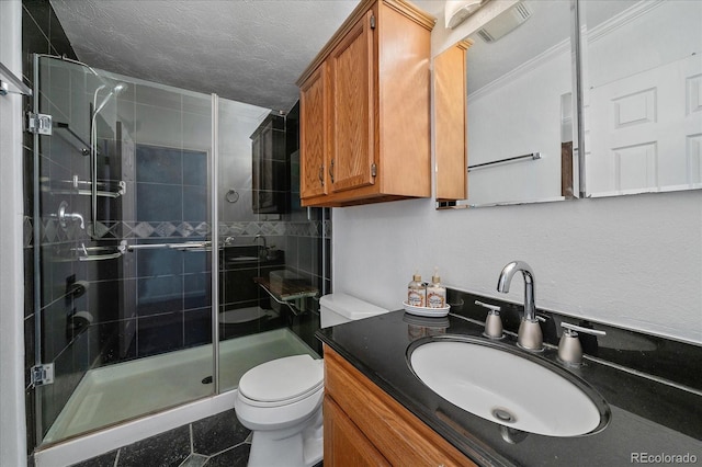 bathroom with an enclosed shower, a textured ceiling, vanity, crown molding, and toilet