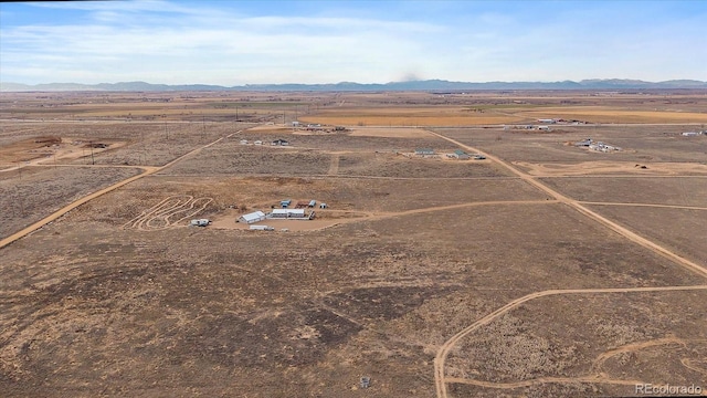 birds eye view of property featuring a mountain view