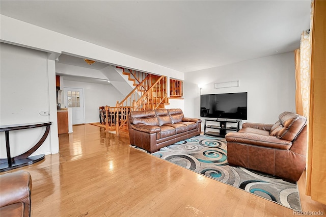 living room with light hardwood / wood-style flooring