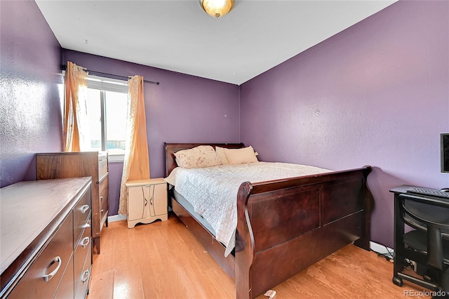 bedroom featuring light wood-type flooring