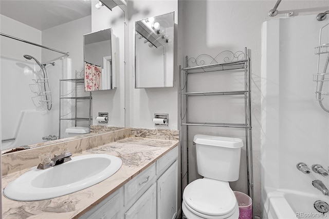 full bathroom featuring bathing tub / shower combination, vanity, and toilet