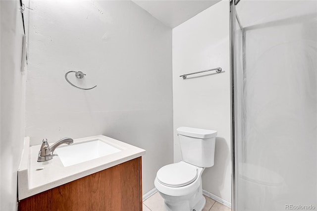 bathroom with tile patterned floors, vanity, and toilet