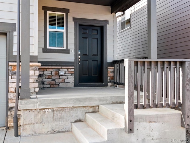 doorway to property featuring covered porch