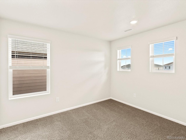 spare room featuring carpet flooring