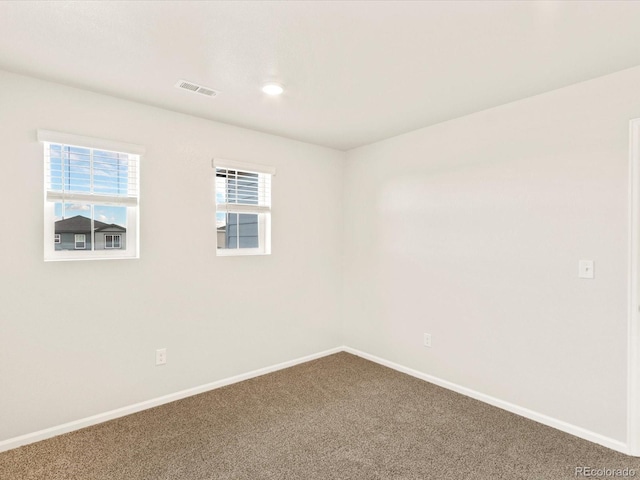 empty room featuring carpet floors