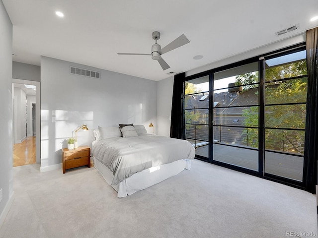 carpeted bedroom featuring ceiling fan and access to outside