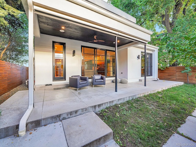 exterior space featuring an outdoor hangout area and ceiling fan