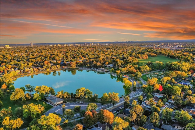 aerial view at dusk with a water view