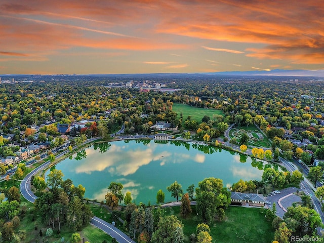 aerial view at dusk with a water view