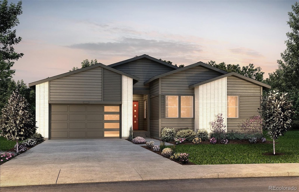 view of front facade featuring a yard and a garage