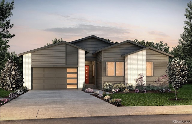 view of front facade featuring a yard and a garage