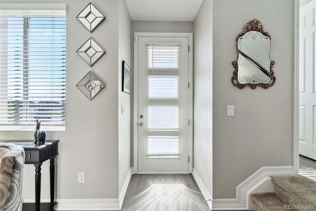 entryway featuring baseboards