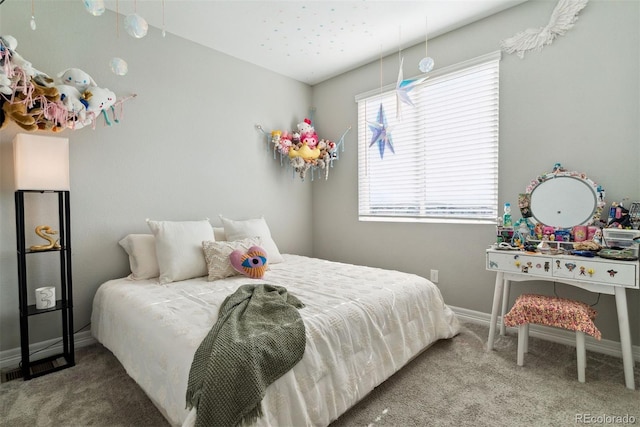 bedroom with carpet flooring and baseboards