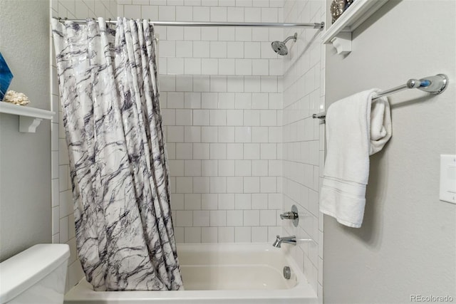 full bathroom featuring shower / bath combo and toilet