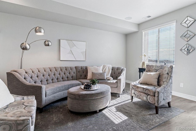 living area featuring wood finished floors and baseboards