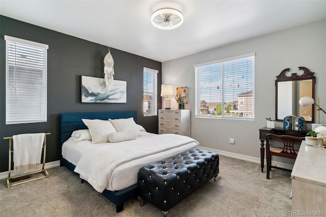 carpeted bedroom featuring baseboards