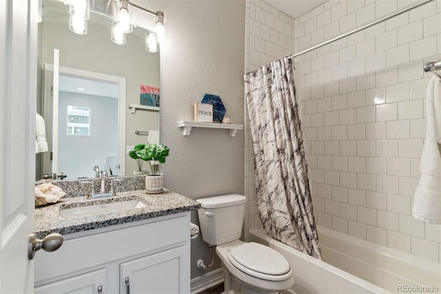 full bathroom featuring shower / bath combination with curtain, toilet, vanity, and a textured wall