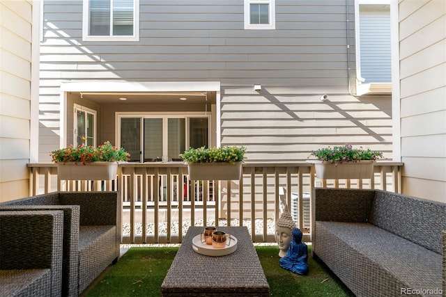 wooden deck featuring outdoor lounge area