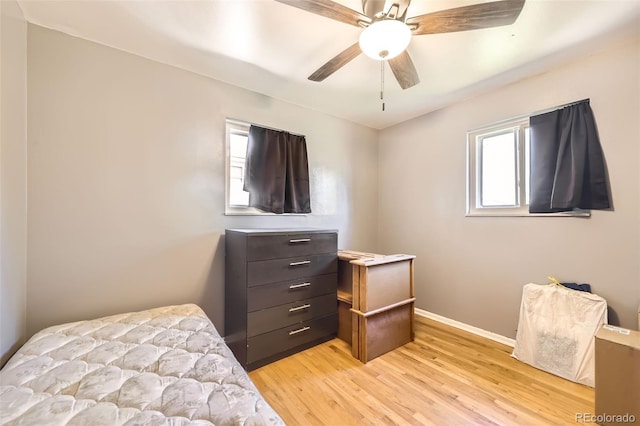 11816 Spring Dr, Northglenn, CO 80233 - bedroom with light wood finished floors, baseboards, and a ceiling fan