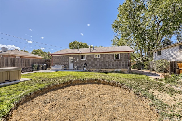 11816 Spring Dr, Northglenn, CO 80233 - rear view of house featuring a patio, brick siding, and central AC