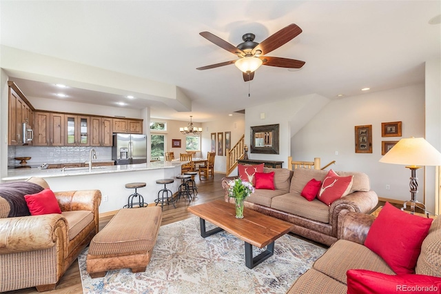 131 Creek Ln, Silverthorne, CO 80498 - living area with a chandelier, ceiling fan, light wood-style flooring, recessed lighting, and stairs