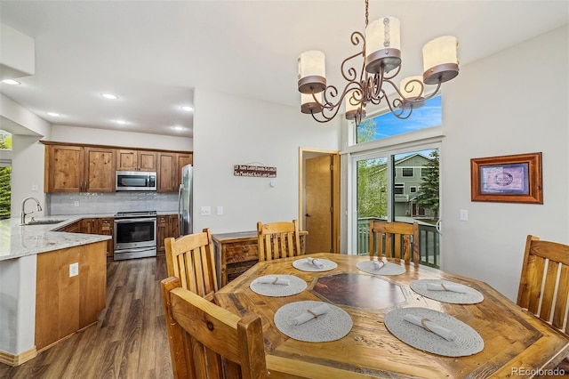 131 Creek Ln, Silverthorne, CO 80498 - dining area with dark wood finished floors, a chandelier, and recessed lighting