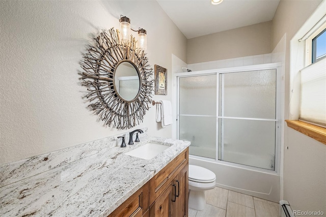 131 Creek Ln, Silverthorne, CO 80498 - full bathroom featuring vanity, enclosed tub / shower combo, and a baseboard radiator