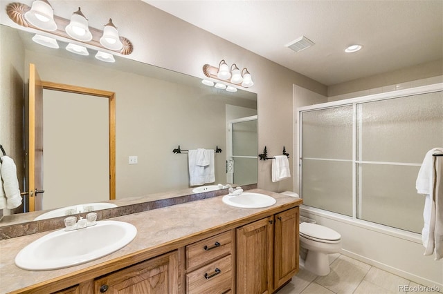 131 Creek Ln, Silverthorne, CO 80498 - bathroom featuring double vanity, bath / shower combo with glass door, and tile patterned floors