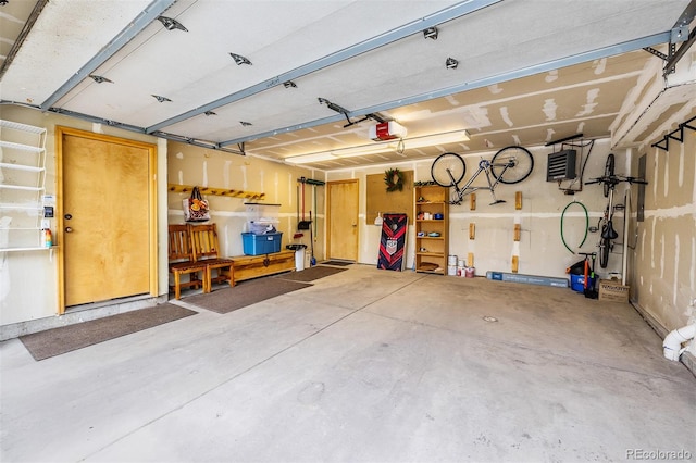 131 Creek Ln, Silverthorne, CO 80498 - garage featuring a garage door opener and a heating unit