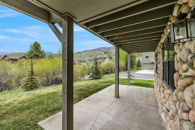 131 Creek Ln, Silverthorne, CO 80498 - view of patio / terrace featuring a mountain view and an outbuilding