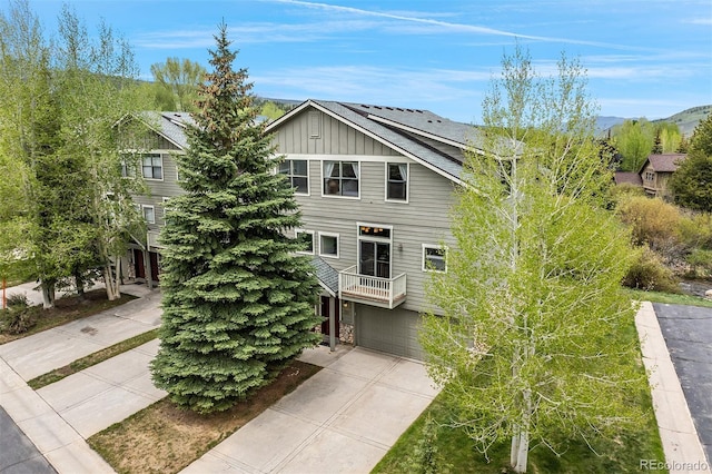 131 Creek Ln, Silverthorne, CO 80498 - view of front of property featuring board and batten siding, concrete driveway, and a garage