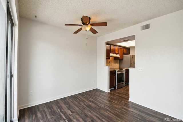 unfurnished living room with ceiling fan, dark hardwood / wood-style floors, and a textured ceiling