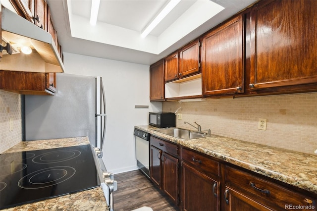 kitchen featuring dark hardwood / wood-style flooring, tasteful backsplash, range, and white dishwasher