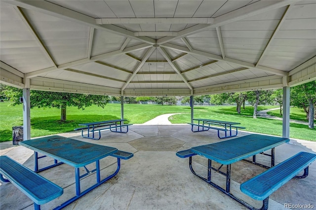 view of property's community featuring a patio area, a yard, and a gazebo